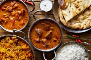 flat lay of indian curry with naan, a typical spread at one of the best indian restaurants dallas tx