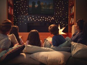 family of four on pillows watching on the best texas tv shows
